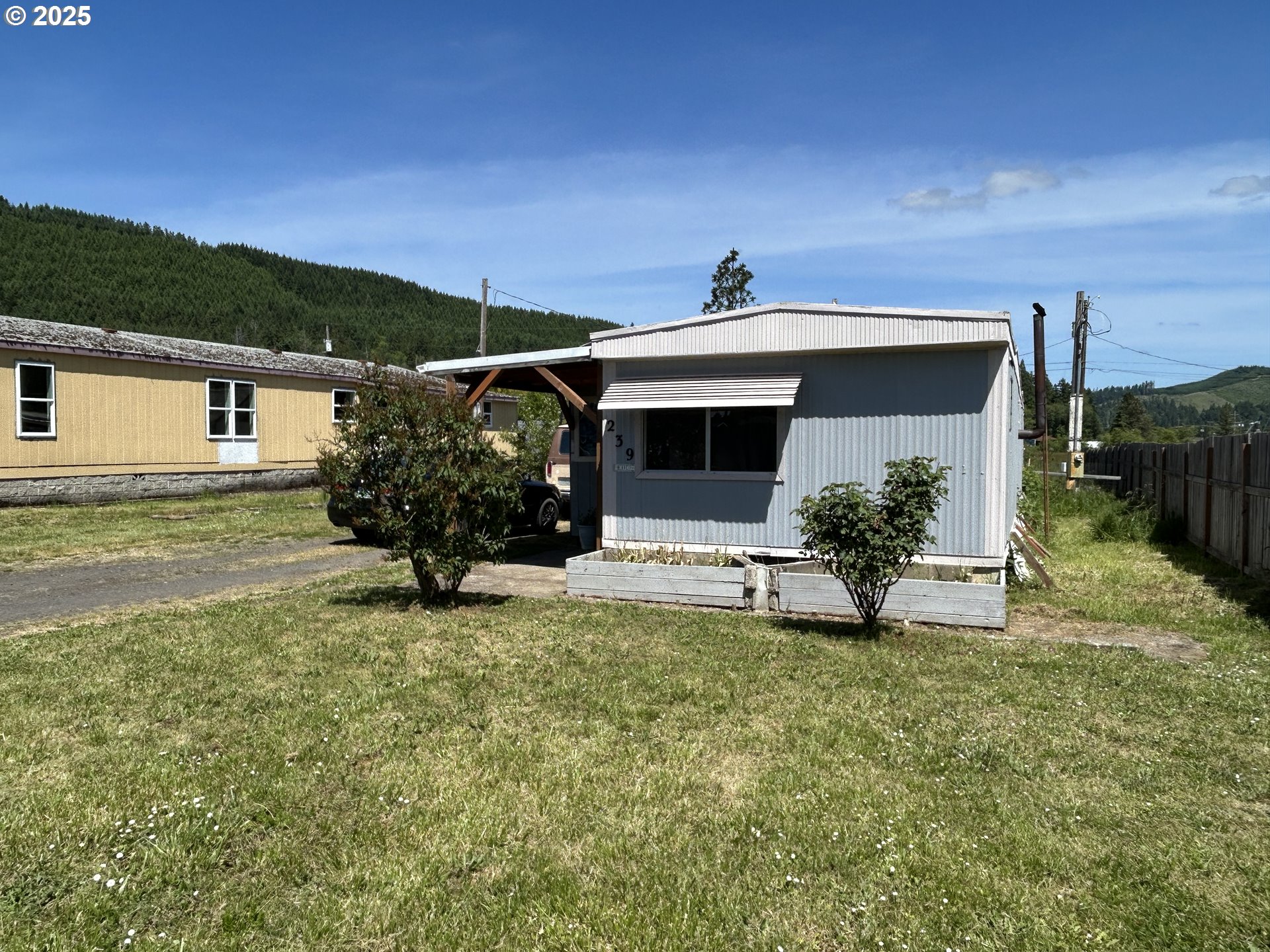 239 Oak Street Yoncalla, OR 97499 - Photo 2 of 15 a front view of a house with a yard
