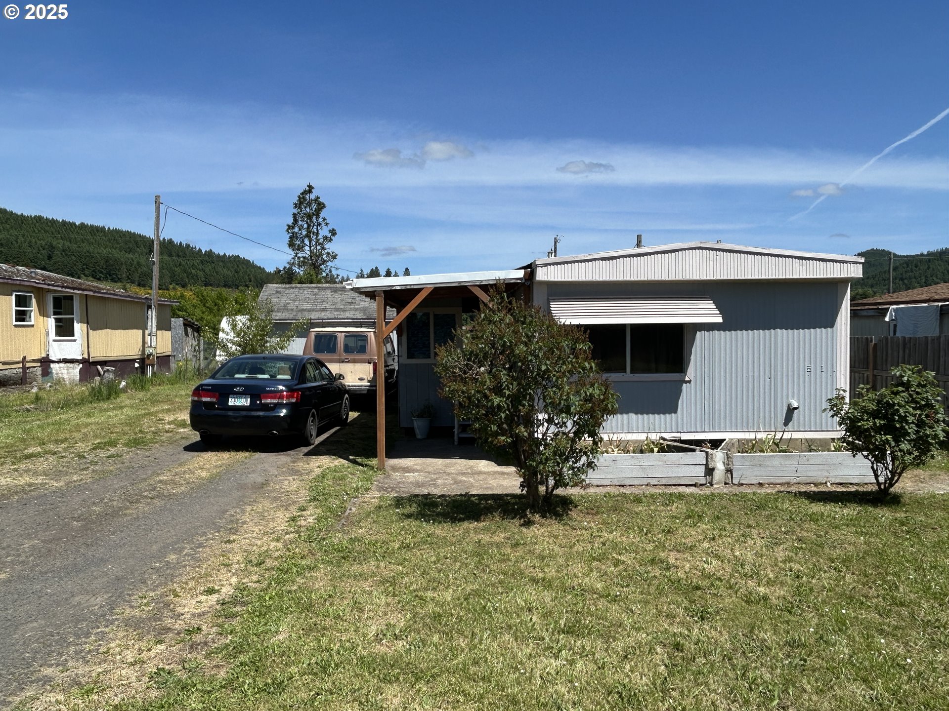 239 Oak Street Yoncalla, OR 97499 - Photo 3 of 15 a view of a house with a patio