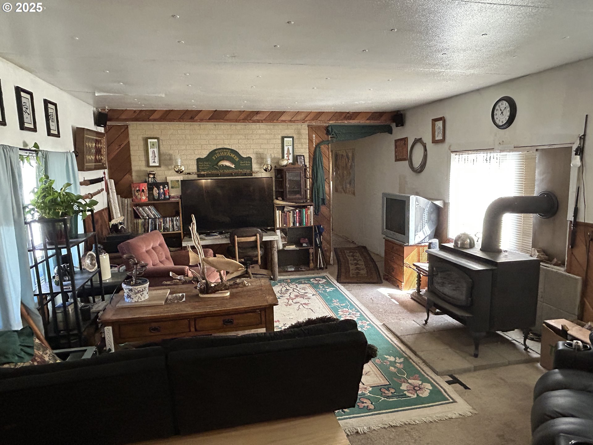 239 Oak Street Yoncalla, OR 97499 - Photo 4 of 15 a living room with furniture and a fireplace