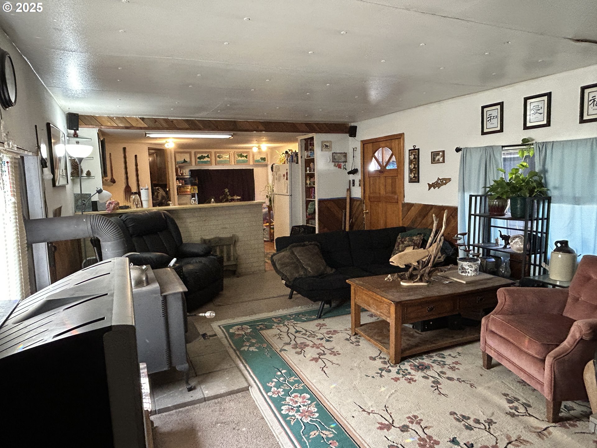 239 Oak Street Yoncalla, OR 97499 - Photo 5 of 15 a living room with furniture and a flat screen tv