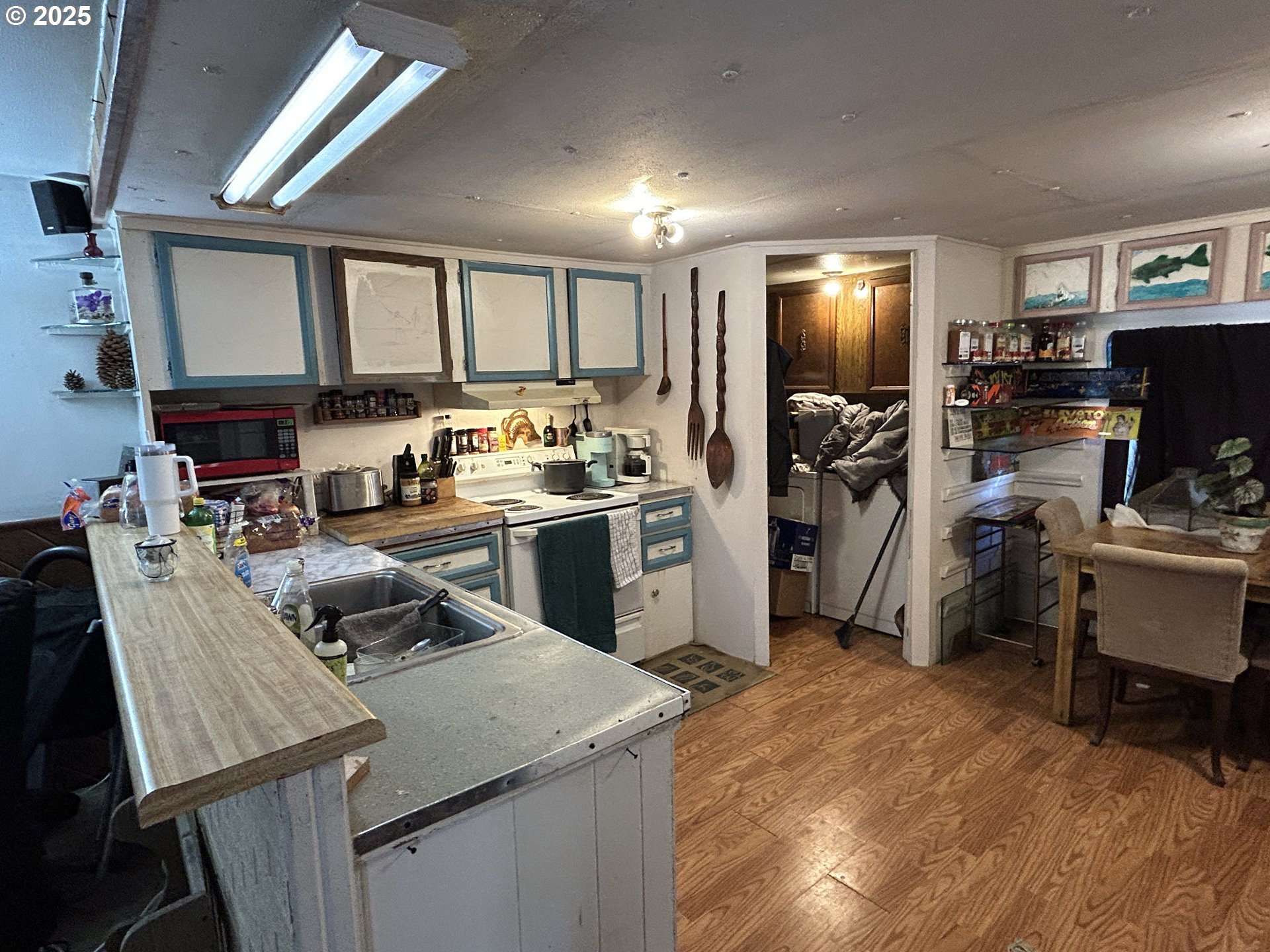 239 Oak Street Yoncalla, OR 97499 - Photo 7 of 15 a kitchen that has a lot of cabinets a sink and a refrigerator