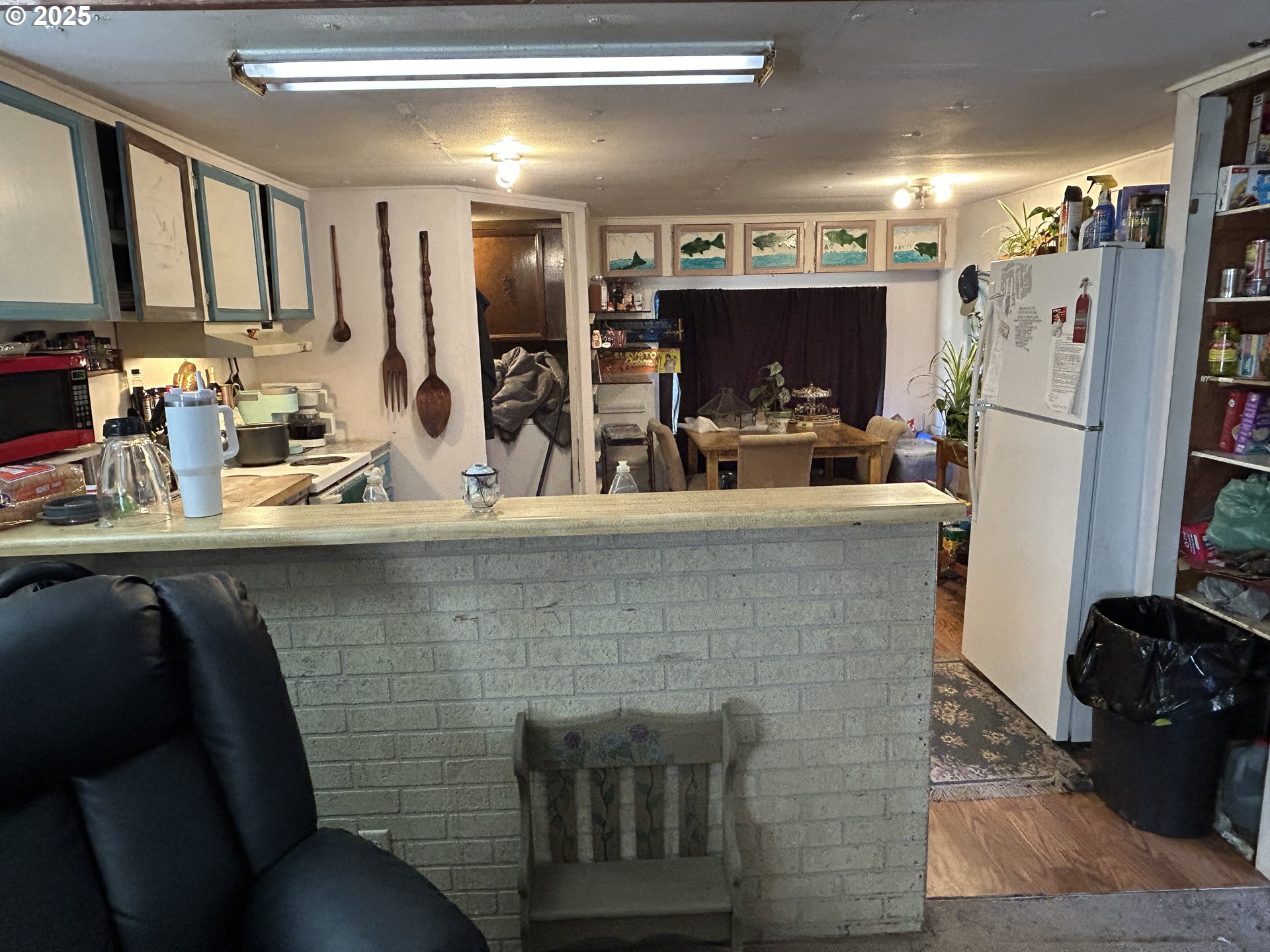 239 Oak Street Yoncalla, OR 97499 - Photo 8 of 15 a view of kitchen with stainless steel appliances kitchen island granite countertop a refrigerator and a stove top oven