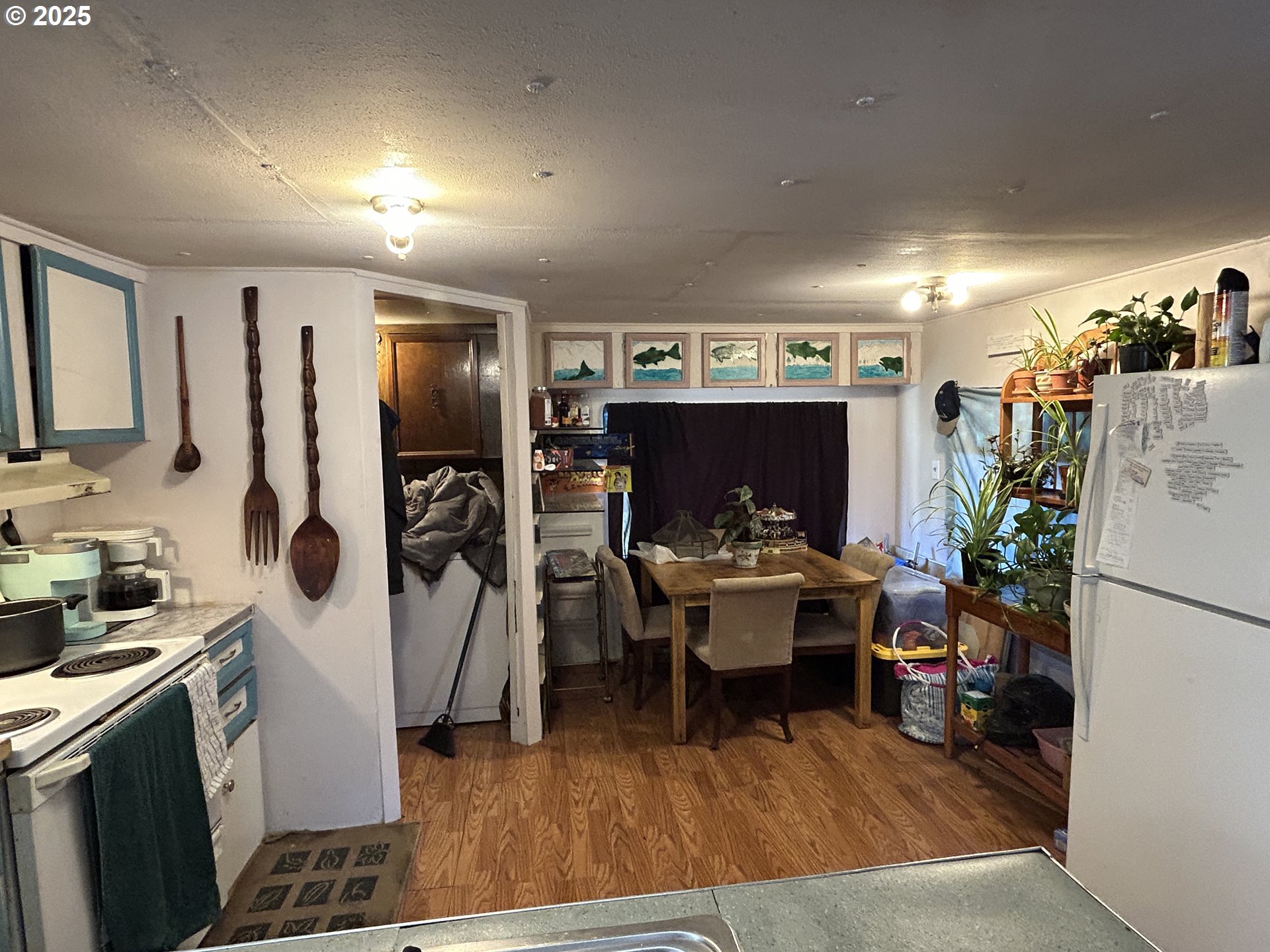 239 Oak Street Yoncalla, OR 97499 - Photo 9 of 15 a living room with furniture and a flat screen tv