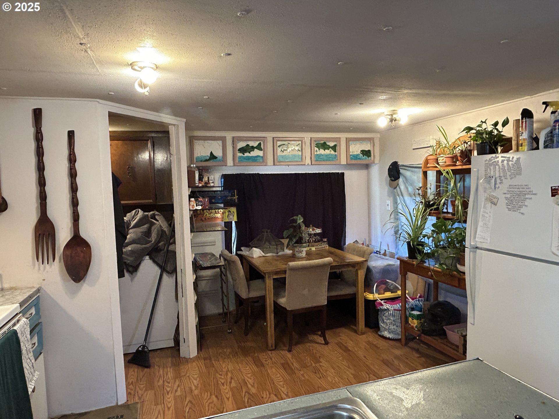 239 Oak Street Yoncalla, OR 97499 - Photo 10 of 15 a living room with furniture a flat screen tv and gym equipment