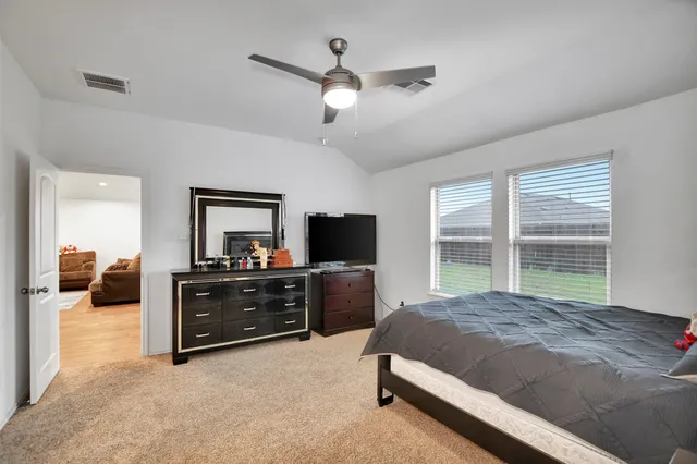 a bathroom with a double vanity sink toilet and a mirror