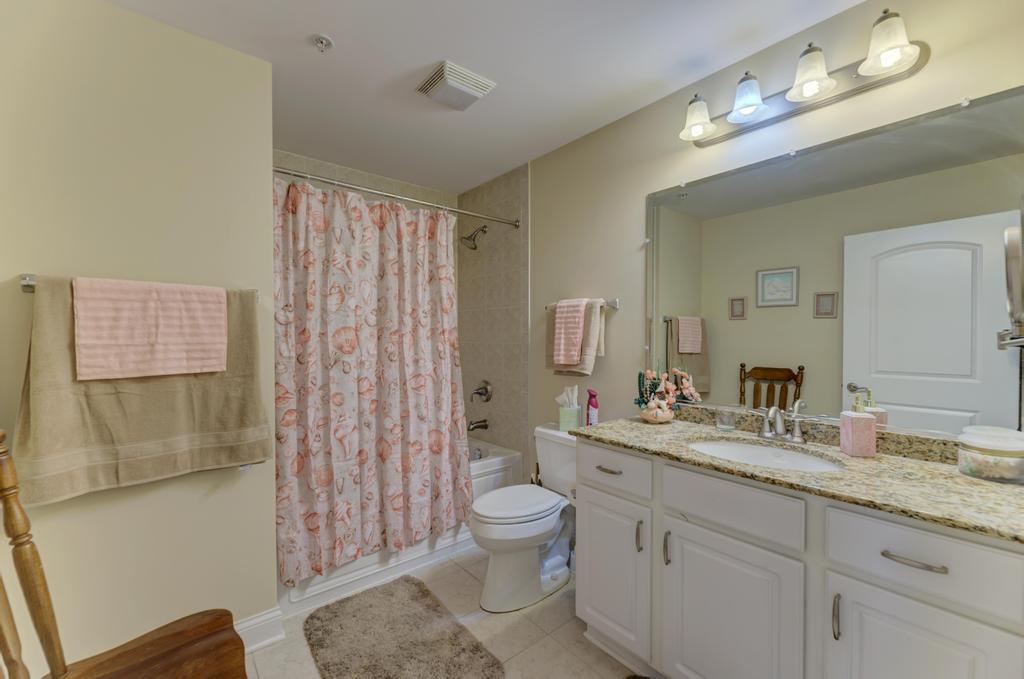 1210 Foxdale Drive, Unit 105 Addison, IL 60101 - Photo 15 of 25 a spacious bathroom with a granite countertop double vanity sink a mirror and a toilet