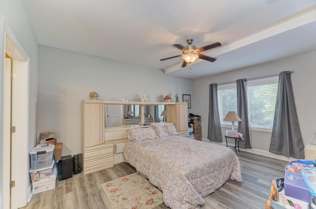 1210 Foxdale Drive, Unit 105 Addison, IL 60101 - Photo 16 of 25 a bedroom with a bed and a large mirror with a dresser