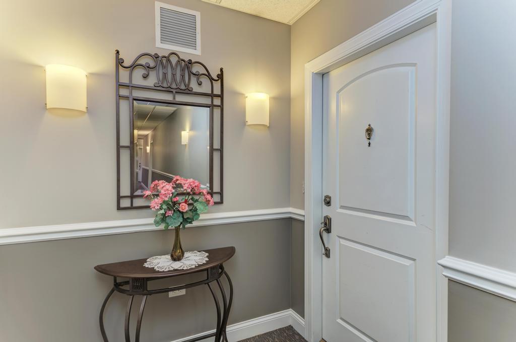 1210 Foxdale Drive, Unit 105 Addison, IL 60101 - Photo 4 of 25 a view of a hallway and dining room