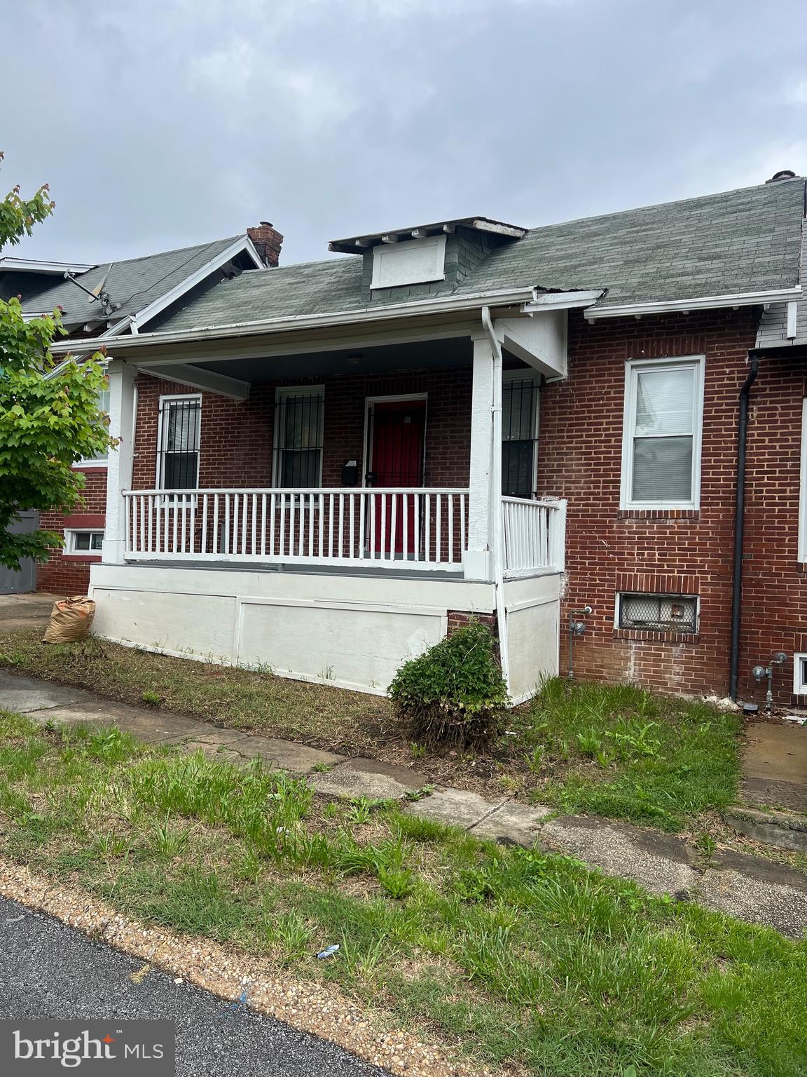 2910 Poplar Terrace Baltimore, MD 21216 - Photo 1 of 14 a front view of a house with garden