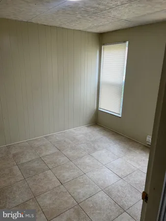 a view of an empty room and a window