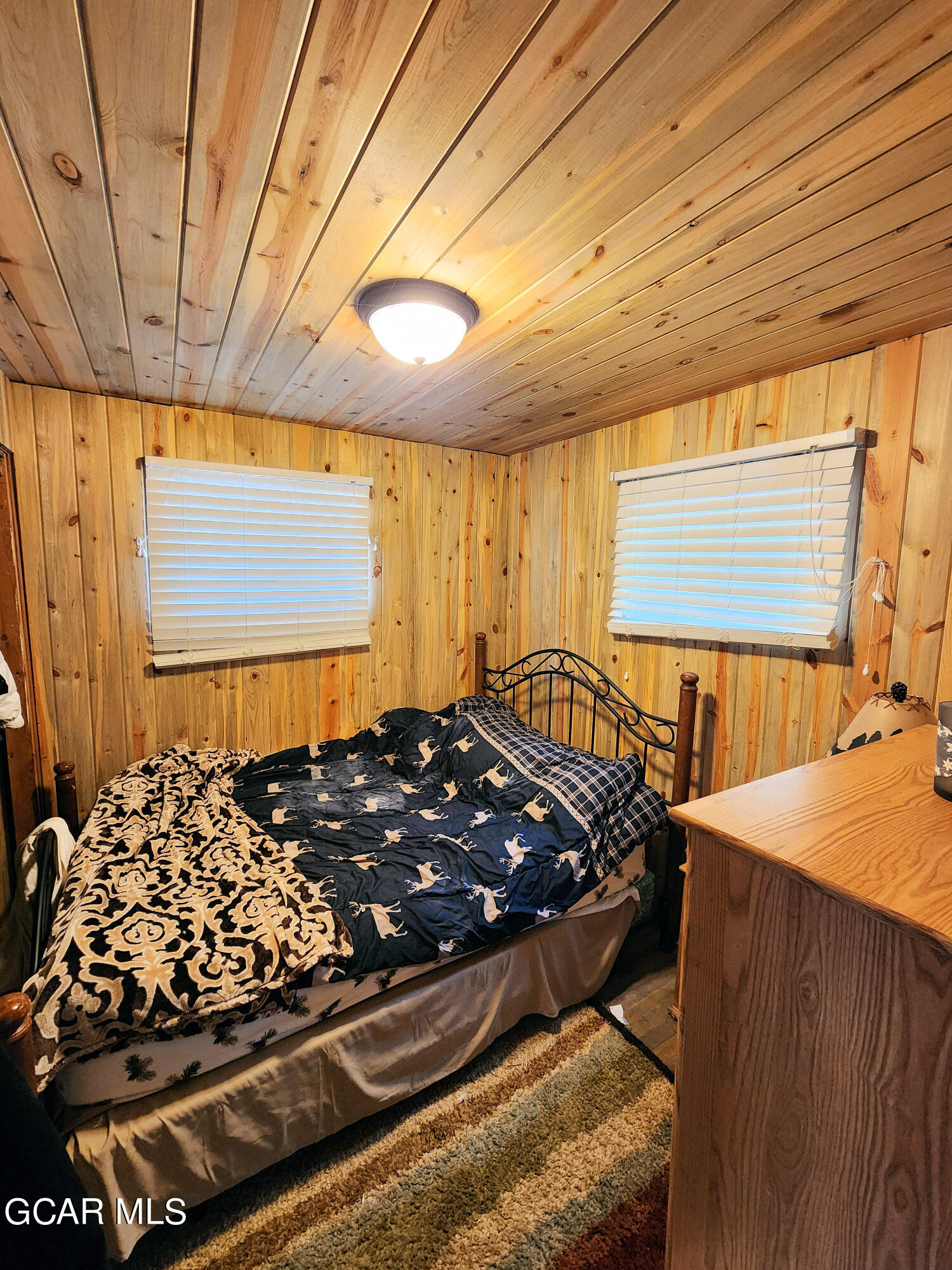 573 97 Circle Breckenridge, CO 80424 - Photo 21 of 40 a bed sitting in a bedroom next to a window