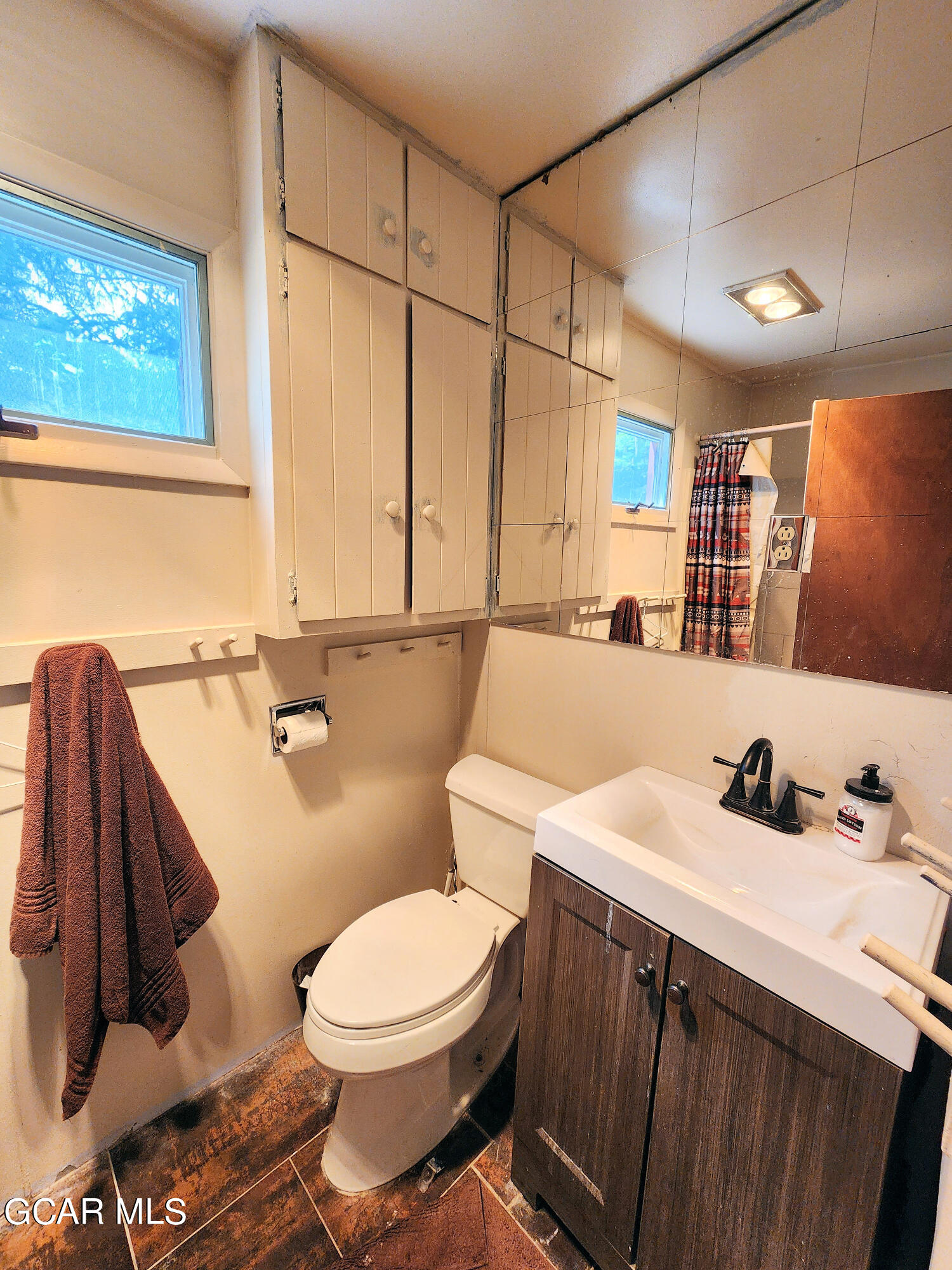 573 97 Circle Breckenridge, CO 80424 - Photo 24 of 40 a bathroom with a sink mirror vanity and toilet