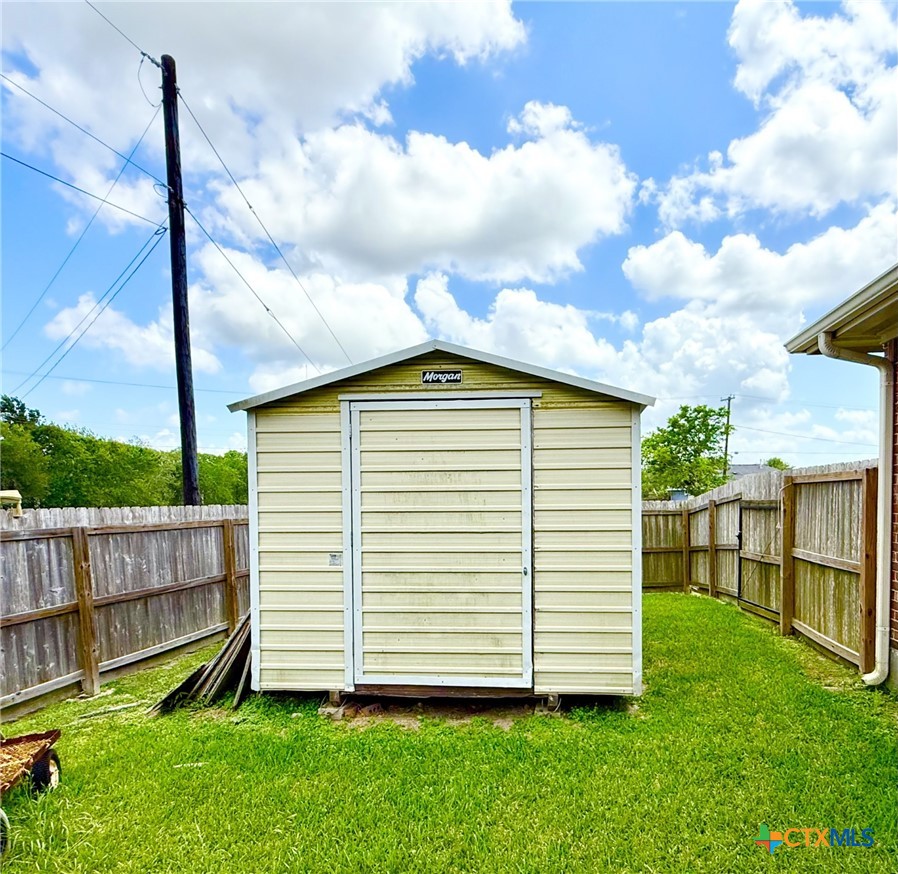 415 South Trinity Street Edna, TX 77957 - Photo 45 of 46 a view of a backyard with a garden