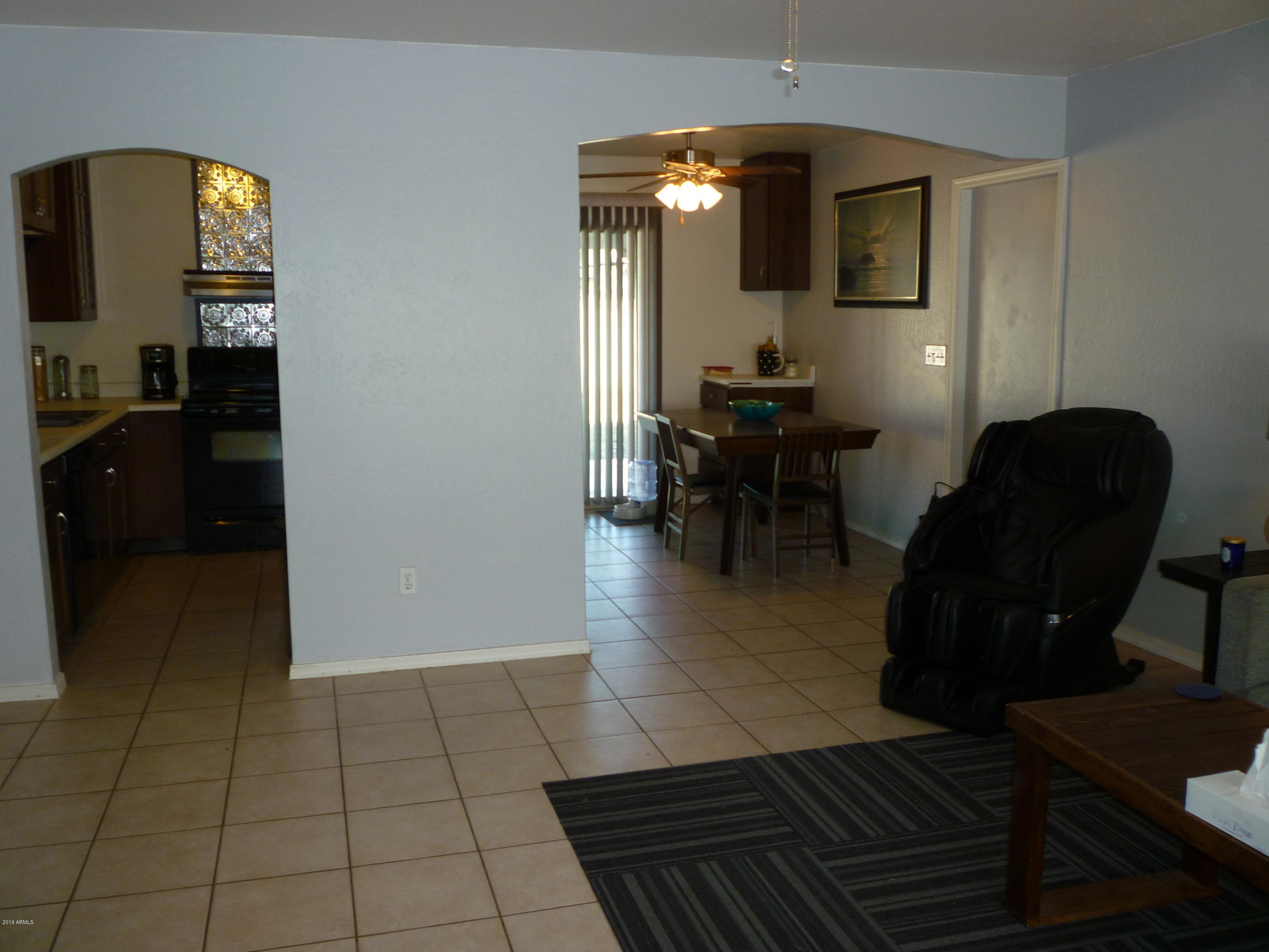 3054 West Cactus Road Phoenix, AZ 85029 - Photo 11 of 31 GREAT ROOM TO KITCHEN/DINING