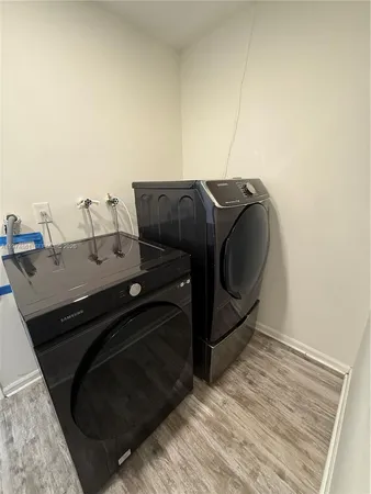 a utility room with washer and dryer