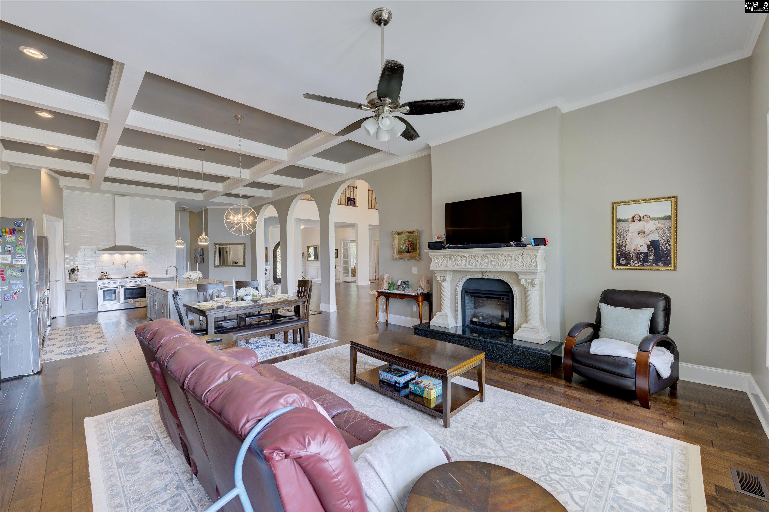 305 Northlake Road Columbia, SC 29223 - Photo 24 of 46 a living room with furniture a fireplace and a flat screen tv