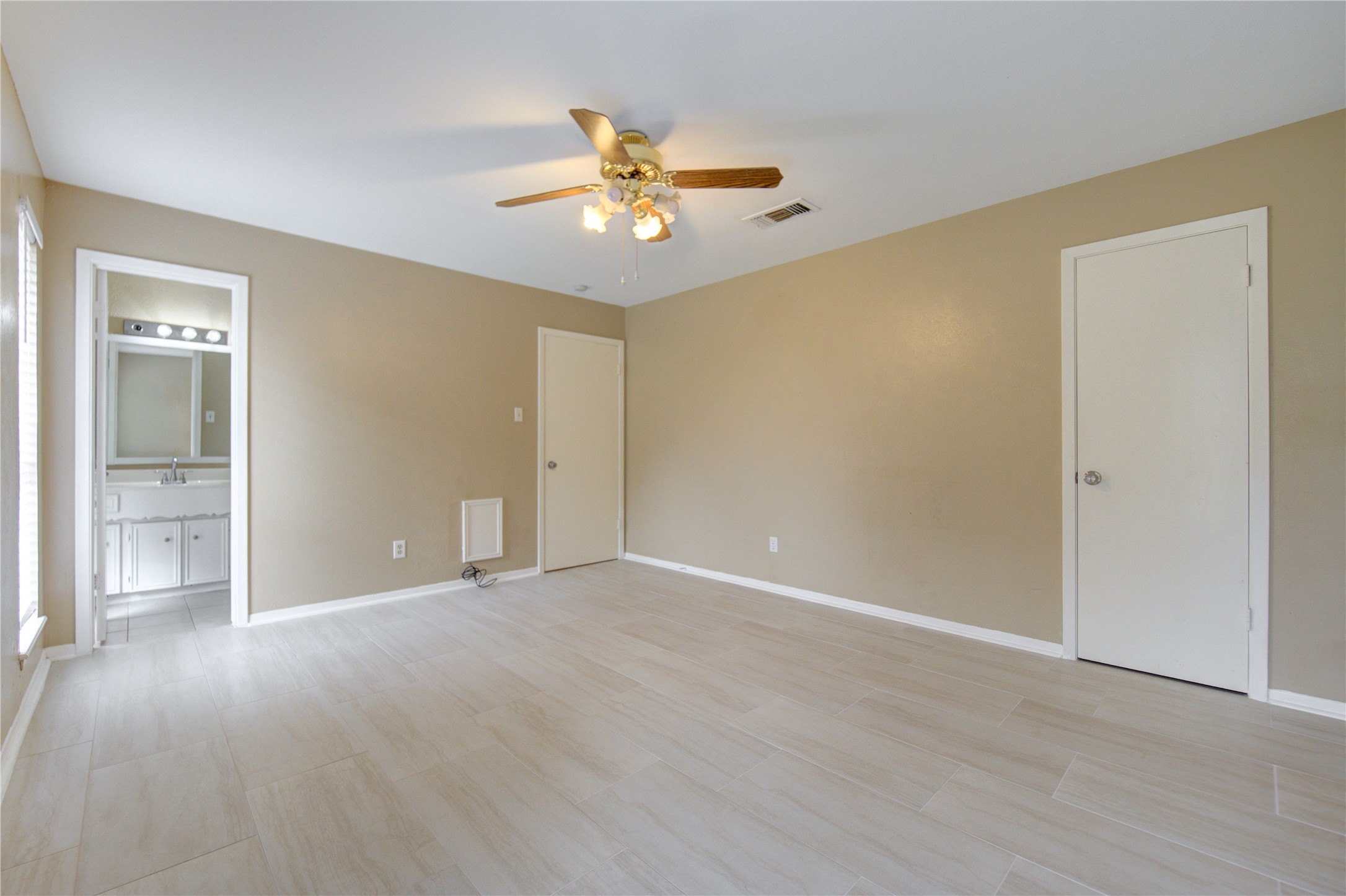 3412 Avenue R Rosenberg, TX 77471 - Photo 26 of 43 a view of an empty room with wooden floor