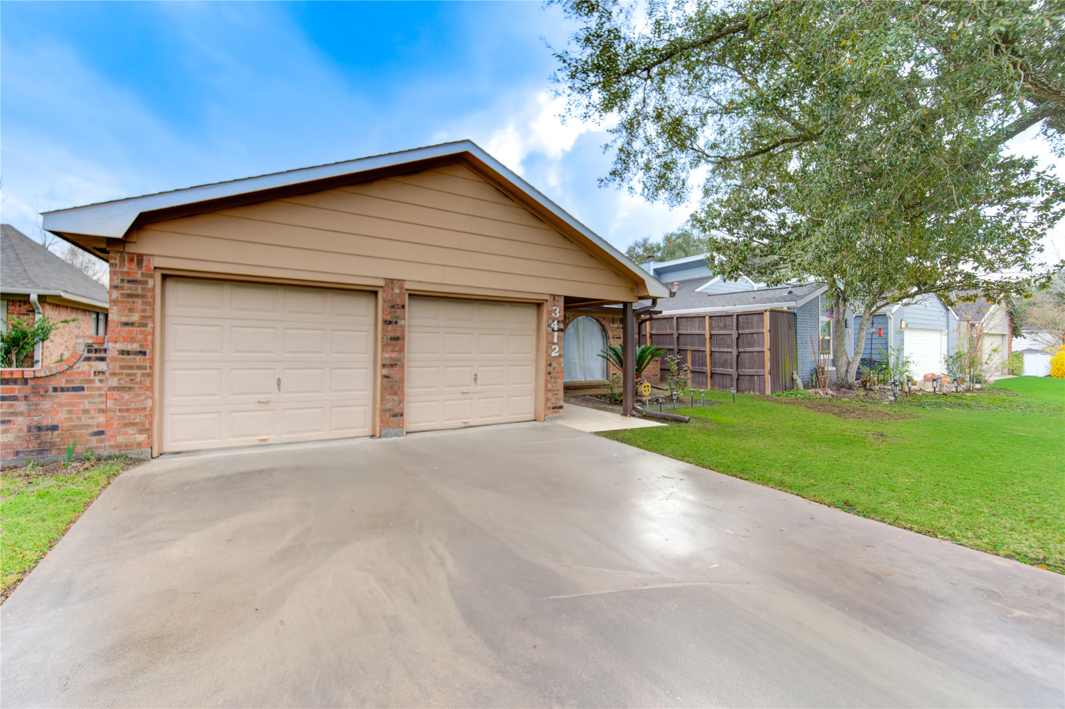 3412 Avenue R Rosenberg, TX 77471 - Photo 4 of 43 a view of a house with a yard and garage