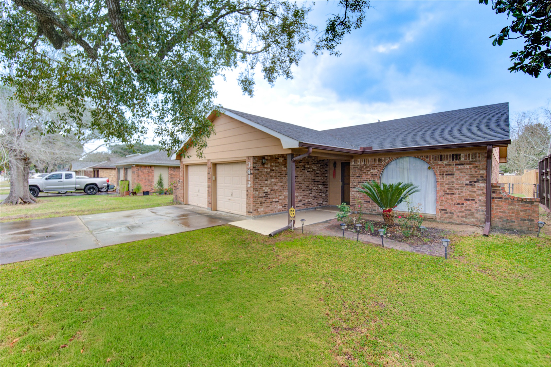 3412 Avenue R Rosenberg, TX 77471 - Photo 7 of 43 a view of a house with a yard and sitting area