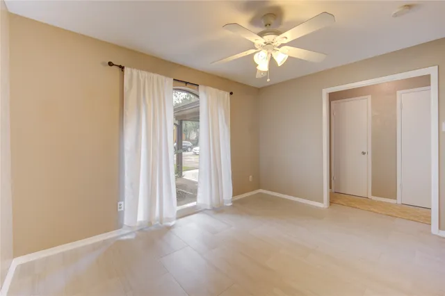 a view of an empty room with a window