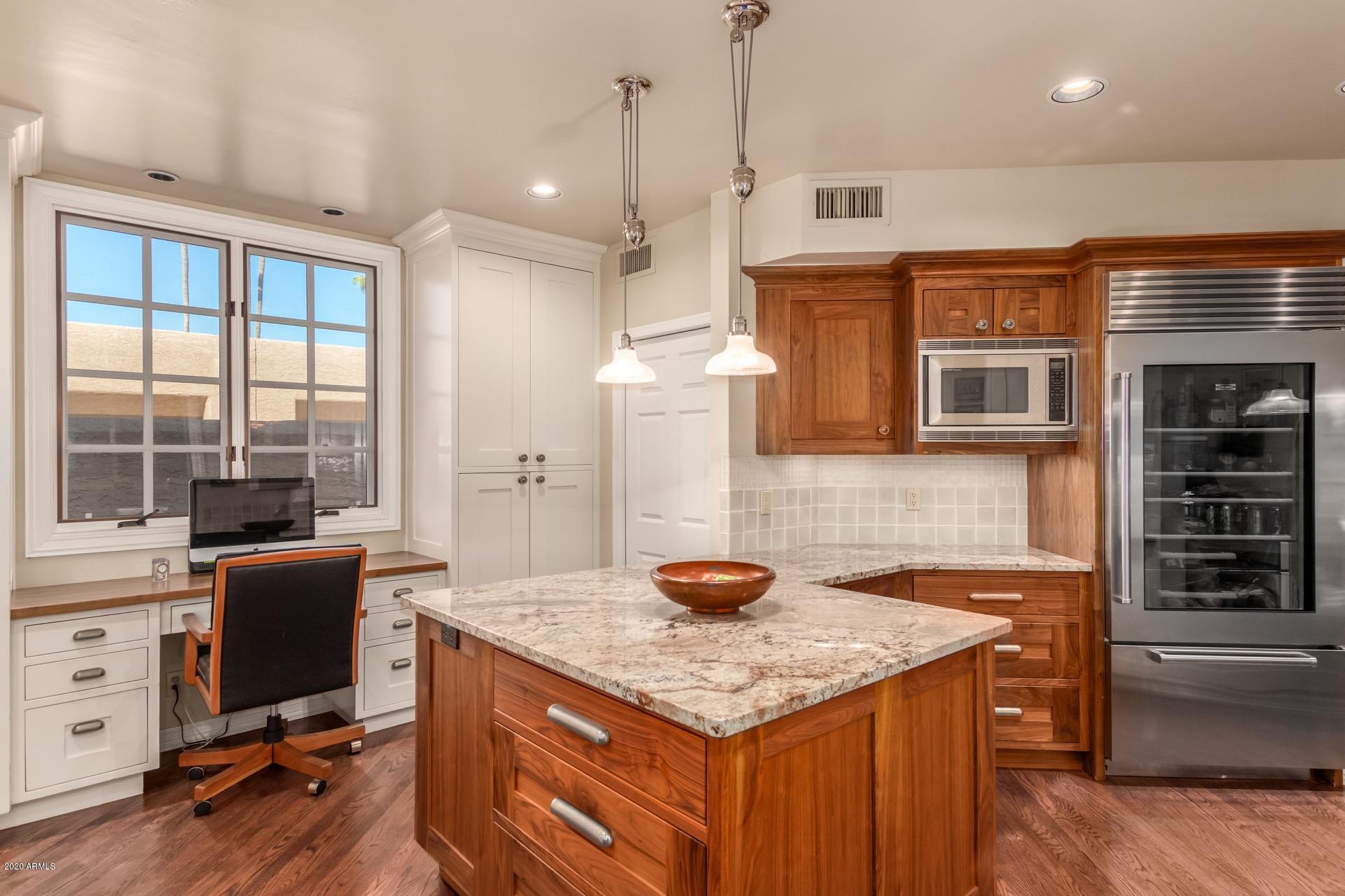 4450 East Camelback Road, Unit 7 Phoenix, AZ 85018 - Photo 21 of 50 Sub Zero fridge, desk nook