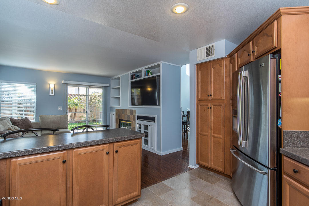1745 Empty Saddle Road Simi Valley, CA 93063 - Photo 15 of 29 a kitchen with stainless steel appliances granite countertop a refrigerator and a sink
