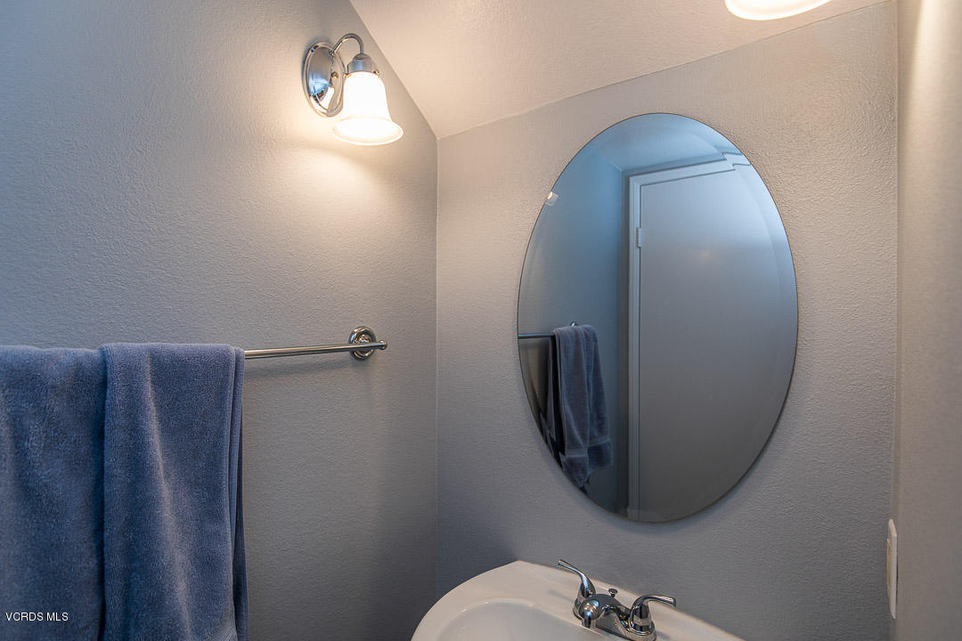 1745 Empty Saddle Road Simi Valley, CA 93063 - Photo 16 of 29 a bathroom with a toilet and mirror