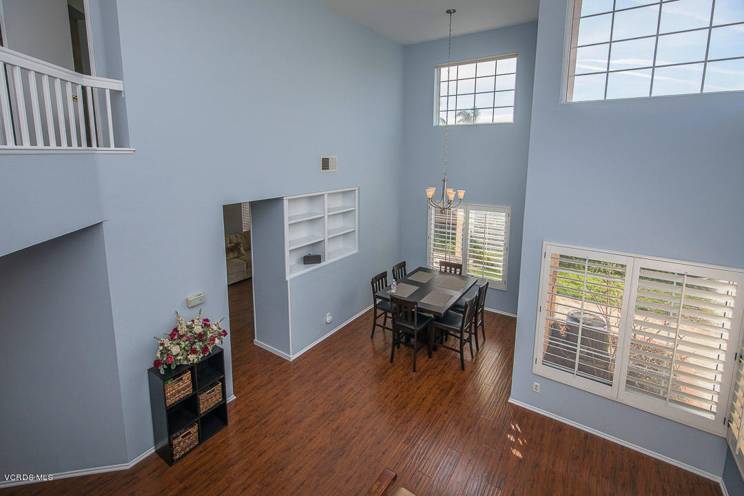 1745 Empty Saddle Road Simi Valley, CA 93063 - Photo 17 of 29 a dining room with furniture entryway and wooden floor