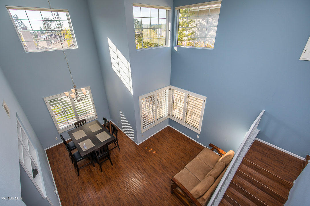 1745 Empty Saddle Road Simi Valley, CA 93063 - Photo 18 of 29 a view of an empty room with wooden floor and windows