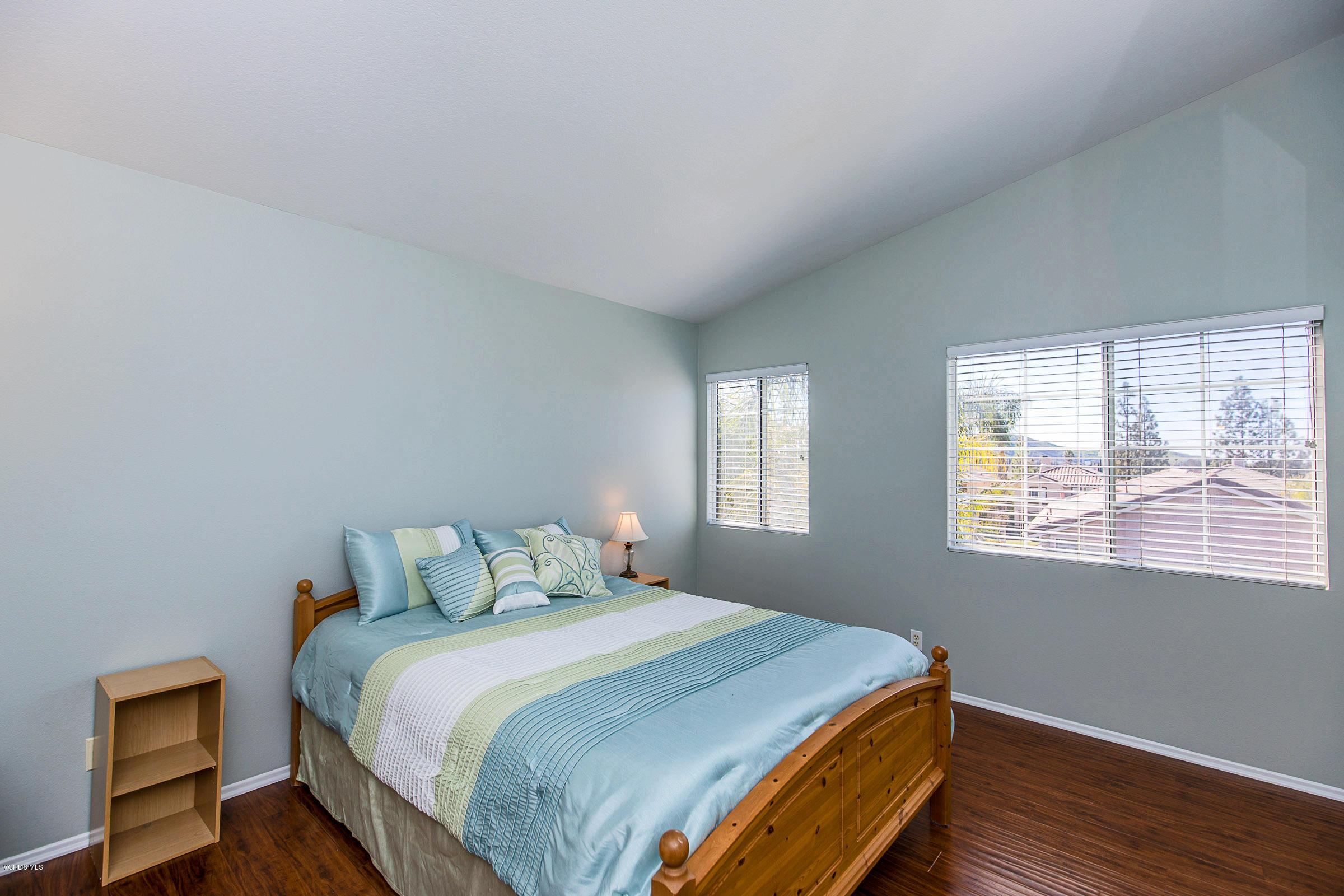 1745 Empty Saddle Road Simi Valley, CA 93063 - Photo 20 of 29 a bedroom with a bed and wooden floor