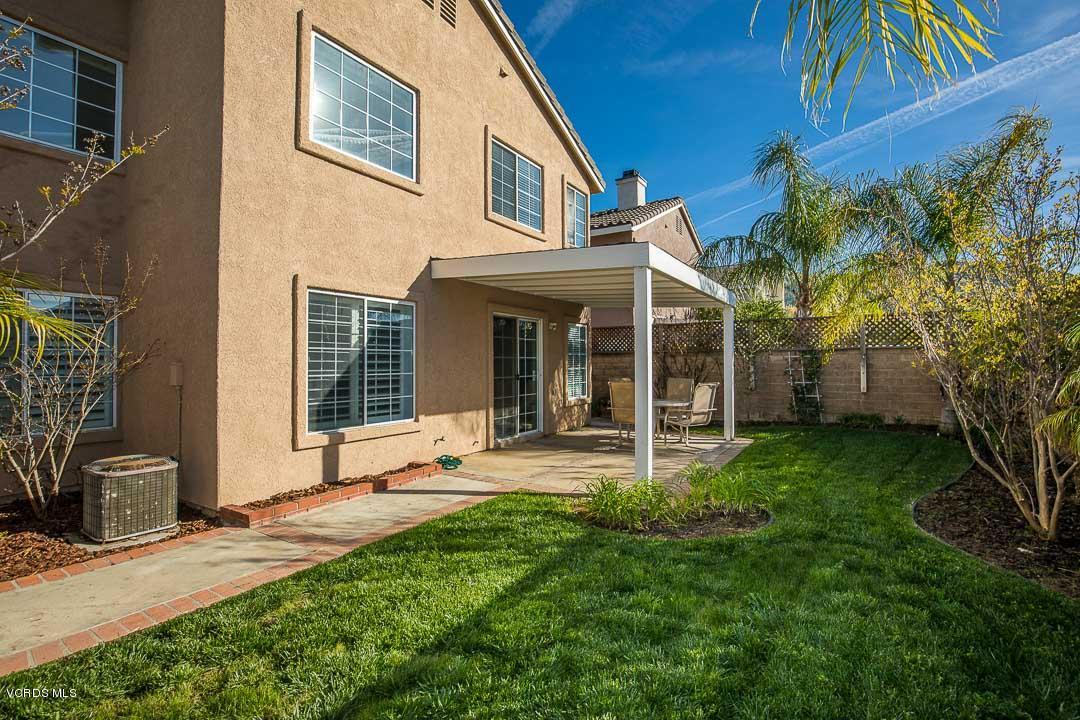 1745 Empty Saddle Road Simi Valley, CA 93063 - Photo 26 of 29 a front view of a house with a yard and chairs