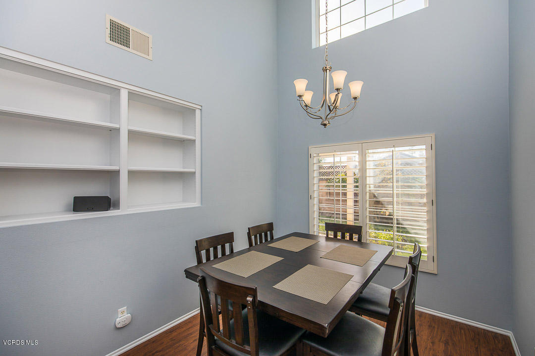 1745 Empty Saddle Road Simi Valley, CA 93063 - Photo 6 of 29 a view of a dining room with furniture window and wooden floor