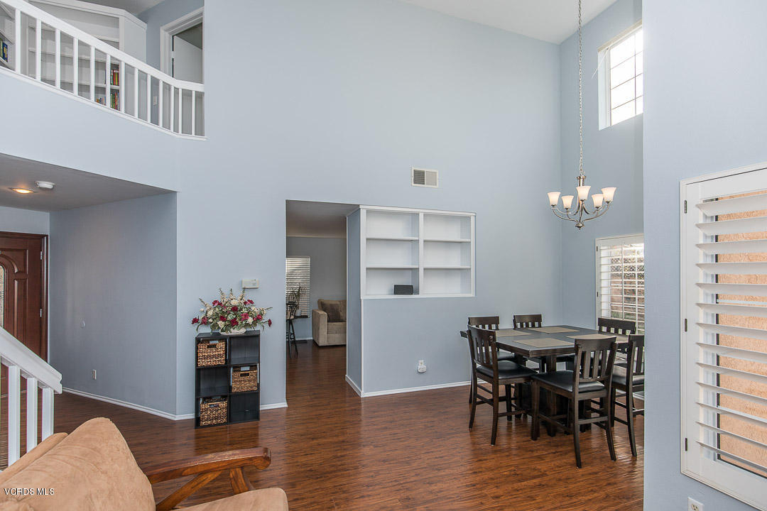 1745 Empty Saddle Road Simi Valley, CA 93063 - Photo 7 of 29 a view of a dining room with furniture and wooden floor