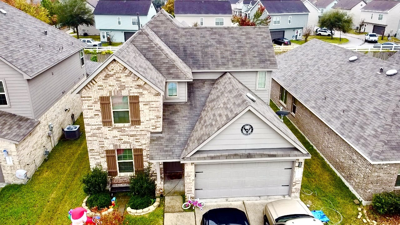 a aerial view of a house with a yard
