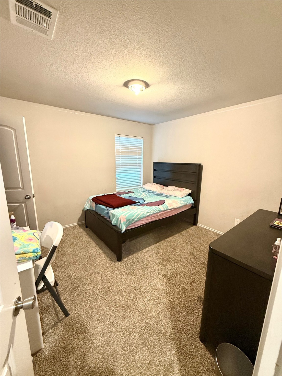 15418 Rancho Plata Drive Channelview, TX 77530 - Photo 11 of 20 a bedroom with a bed and furniture