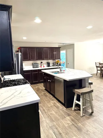 a kitchen with a sink cabinets and window