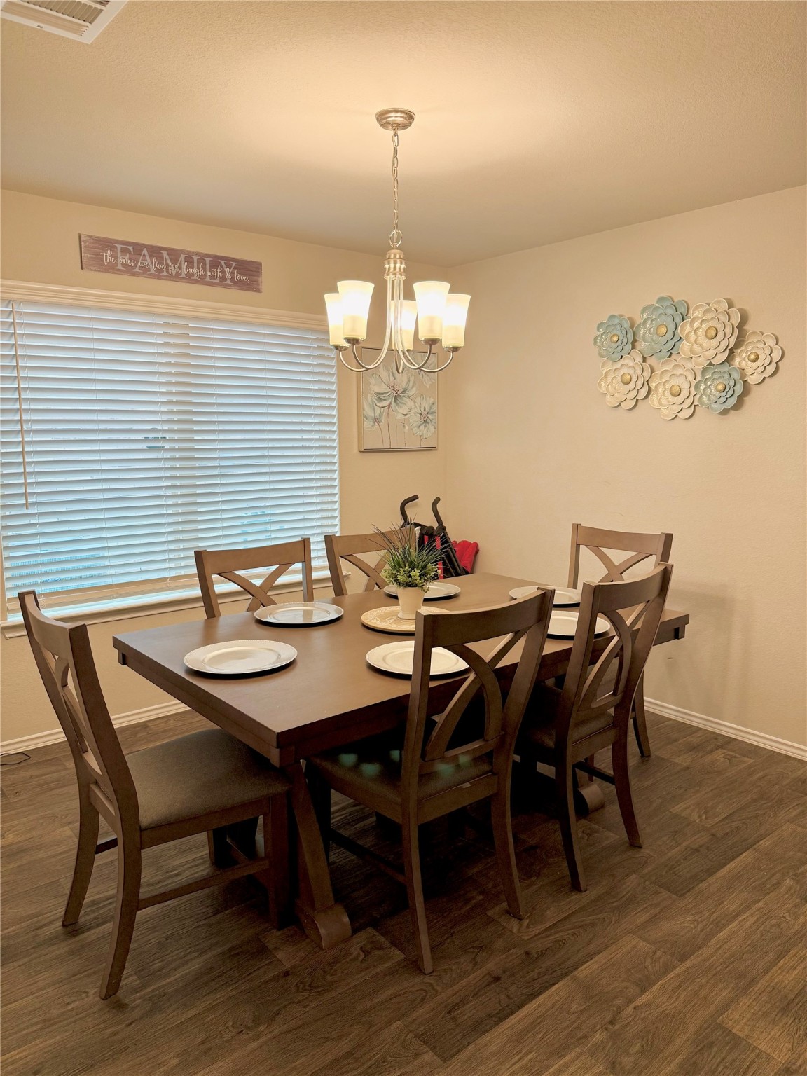 15418 Rancho Plata Drive Channelview, TX 77530 - Photo 6 of 20 a view of a dining room with furniture wooden floor and chandelier