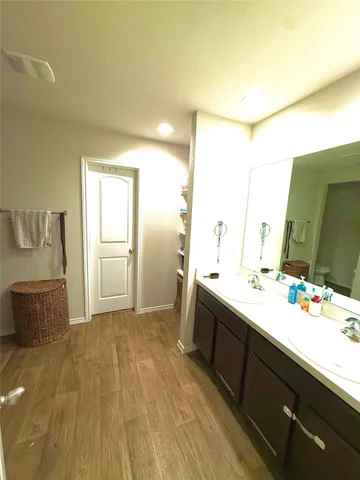a bathroom with a sink and mirror