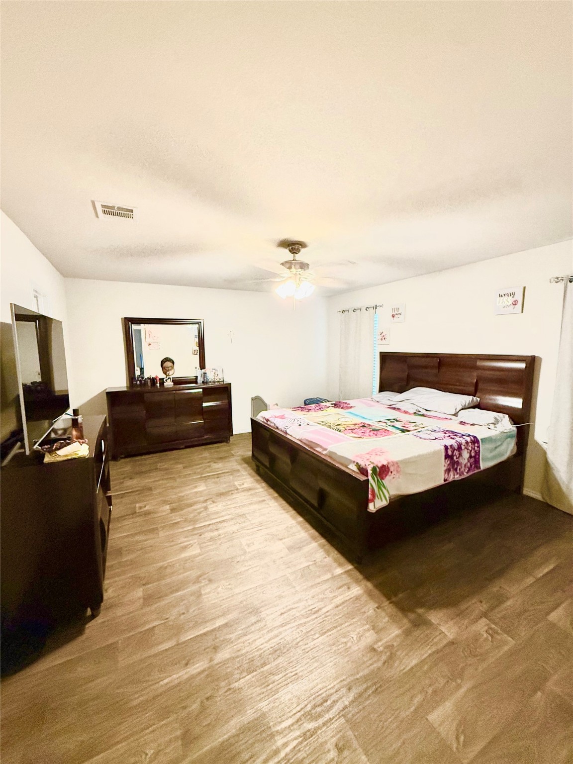 15418 Rancho Plata Drive Channelview, TX 77530 - Photo 10 of 20 a bedroom with a bed and furniture