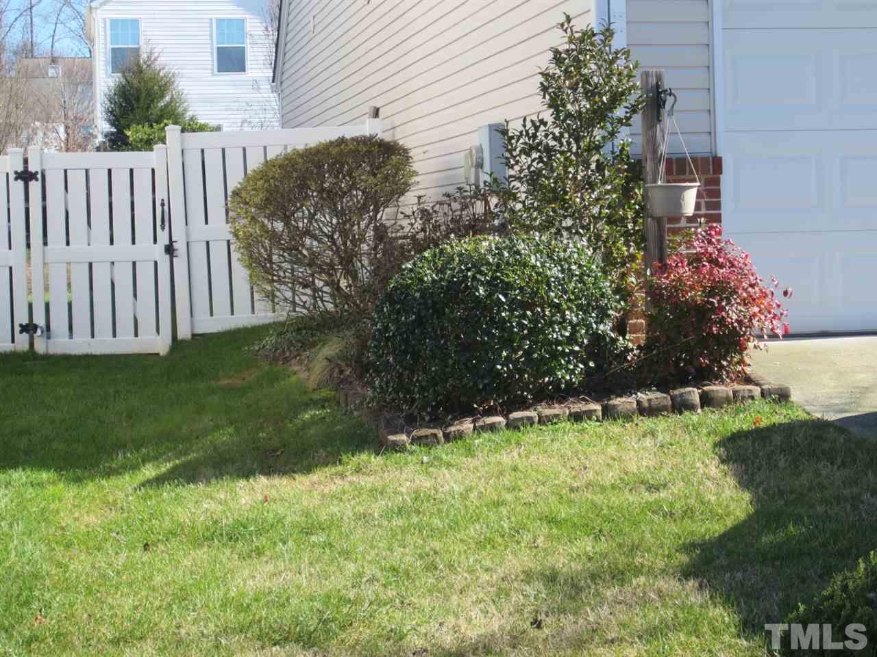 9901 Treymore Drive Raleigh, NC 27617 - Photo 14 of 25 a view of a backyard with plants