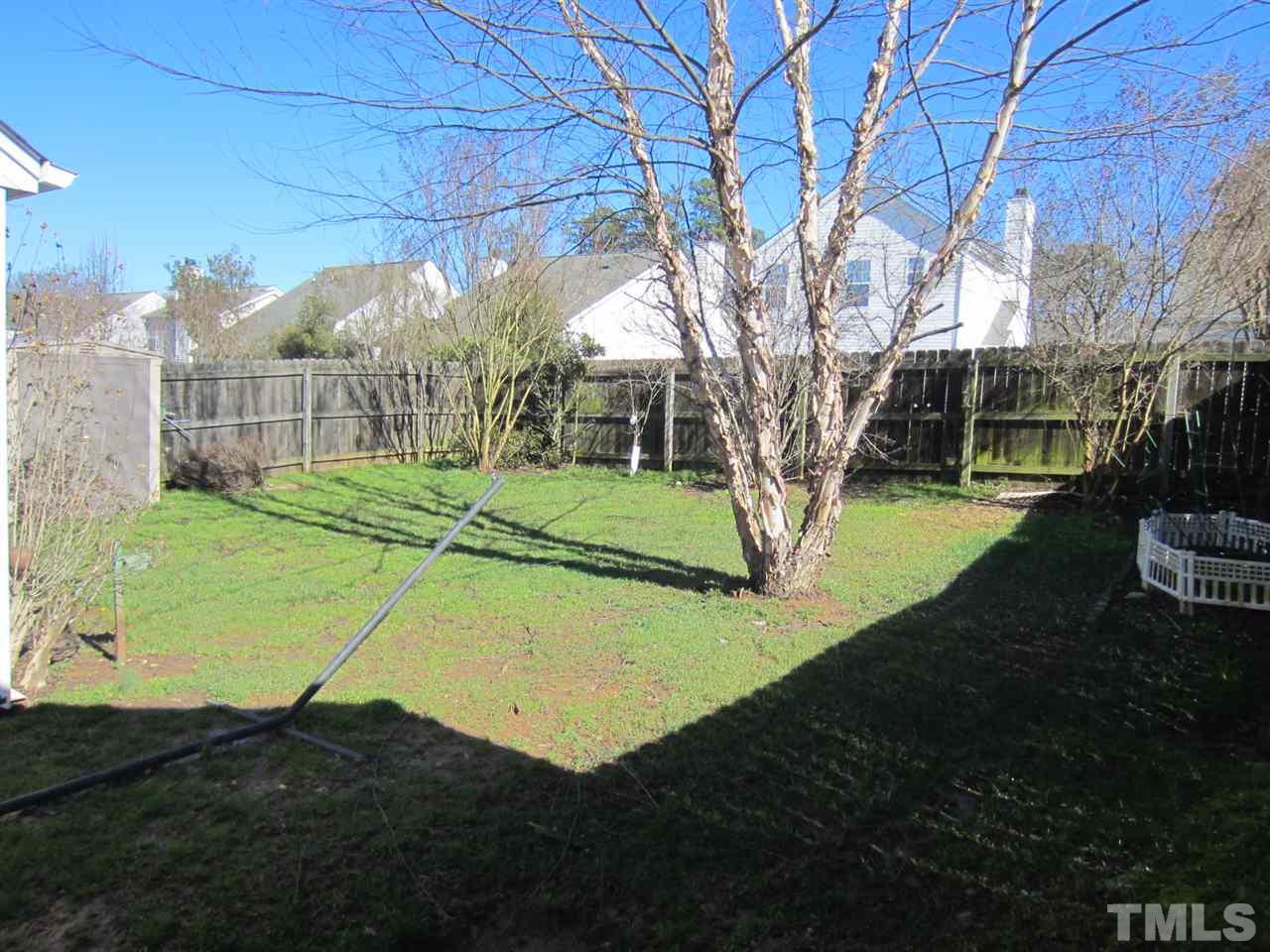 9901 Treymore Drive Raleigh, NC 27617 - Photo 4 of 25 a view of a yard with basketball court
