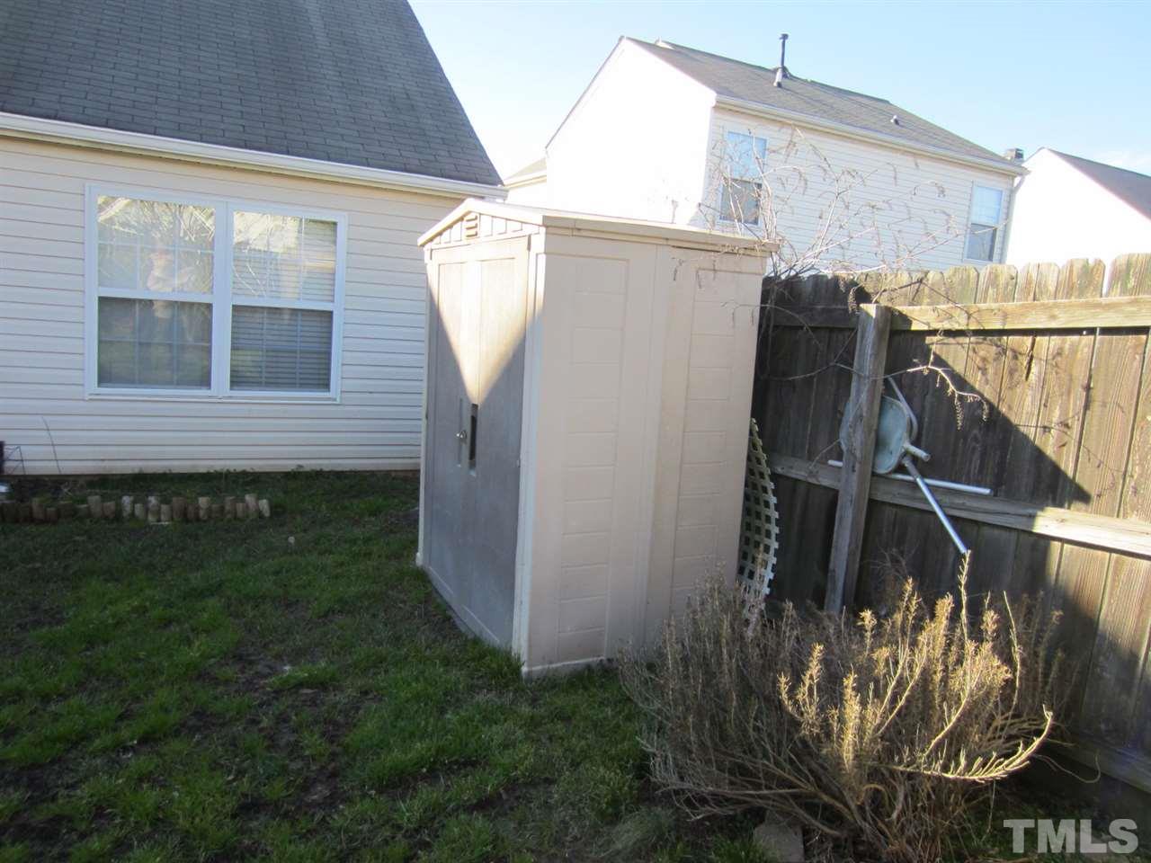 9901 Treymore Drive Raleigh, NC 27617 - Photo 6 of 25 a view of a house with a yard