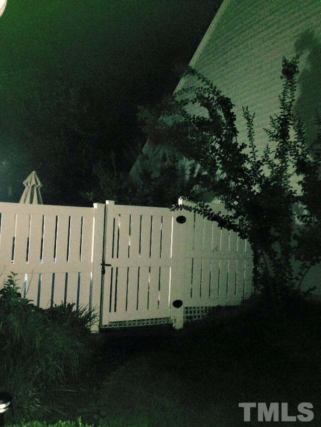 9901 Treymore Drive Raleigh, NC 27617 - Photo 7 of 25 a view of a wall with a garden