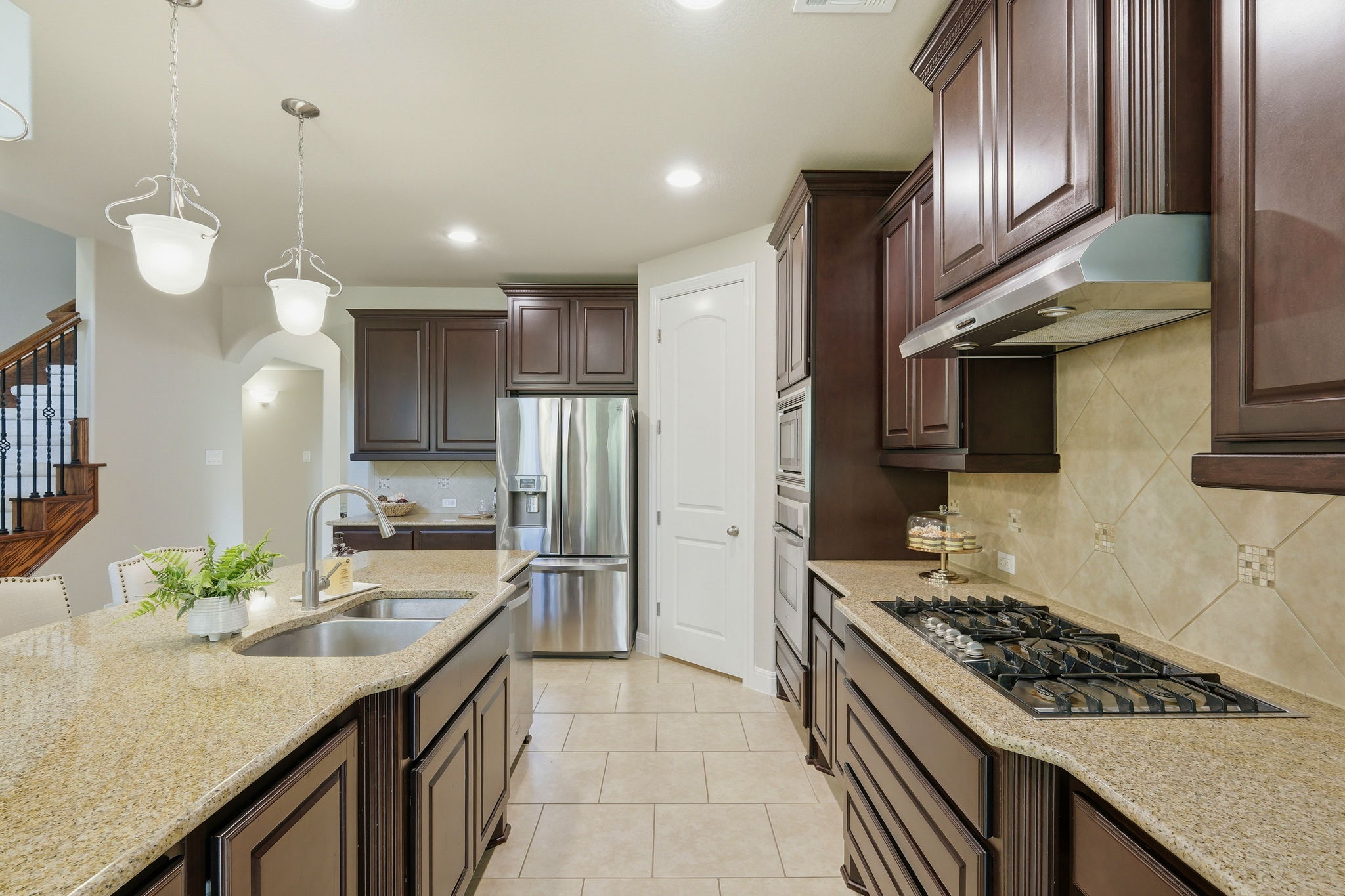 110 Dasher Drive Cedar Park, TX 78613 - Photo 12 of 39 A chef's kitchen features stainless steel appliances and abundant cabinetry, ready for culinary creations.