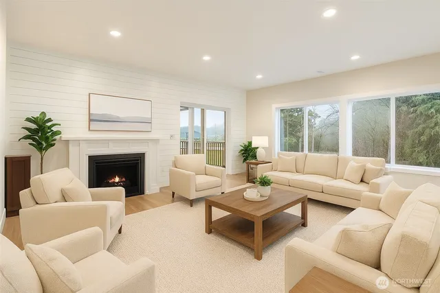 a living room with furniture a rug and a table