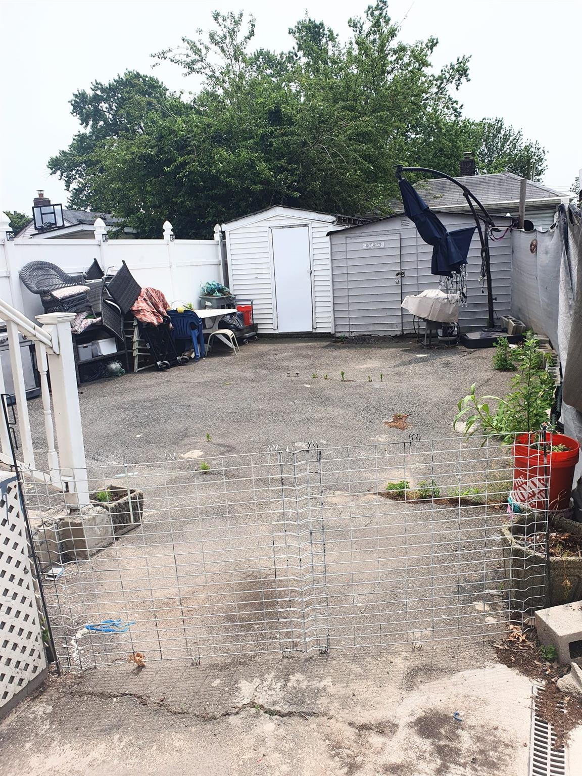 128-26 Gotham Road Queens, NY 11420 - Photo 16 of 16 a view of a back yard of the house