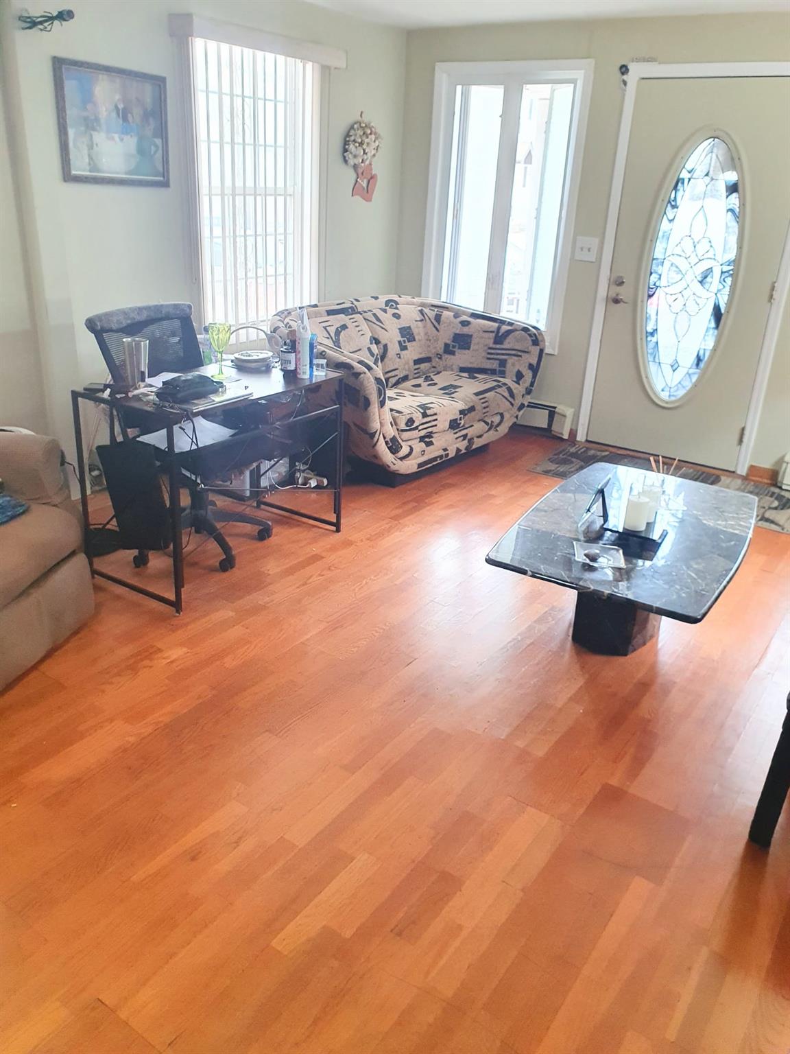 128-26 Gotham Road Queens, NY 11420 - Photo 5 of 16 a living room with furniture and a large window