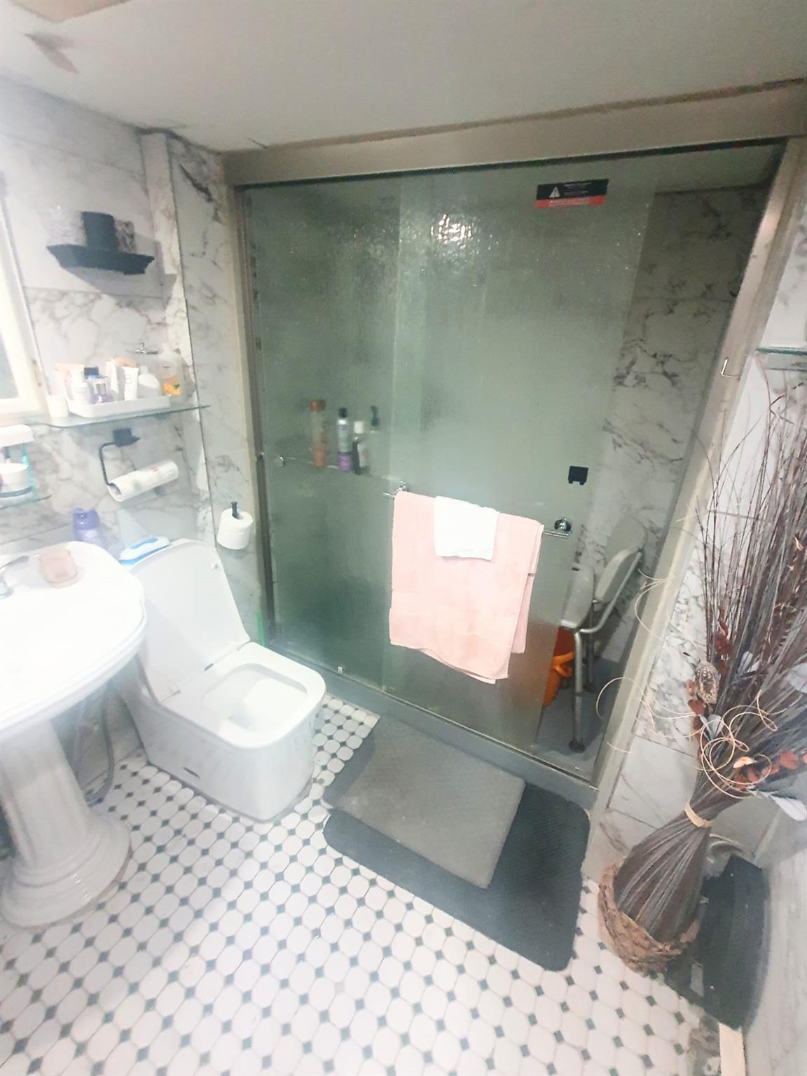 128-26 Gotham Road Queens, NY 11420 - Photo 8 of 16 a bathroom with a toilet and a shower