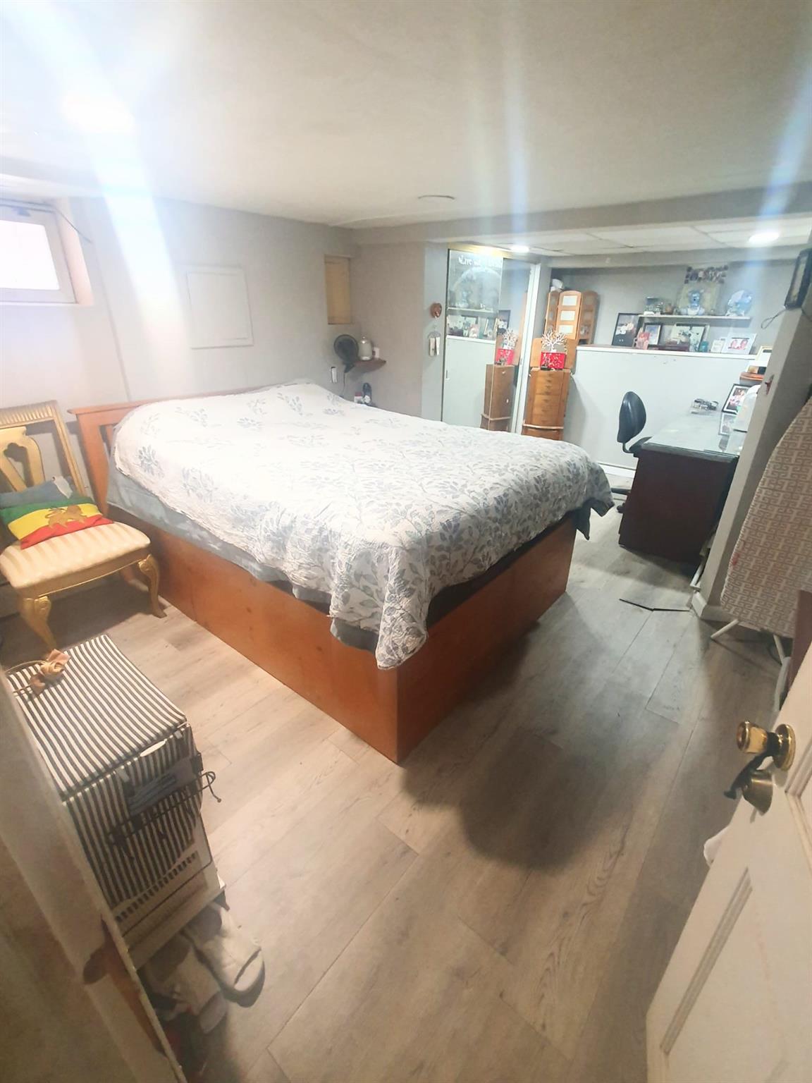 128-26 Gotham Road Queens, NY 11420 - Photo 9 of 16 a bedroom with a bed and window