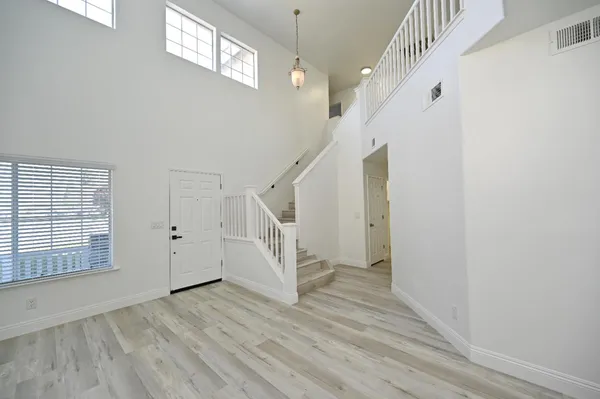 a kitchen with stainless steel appliances a refrigerator and a stove